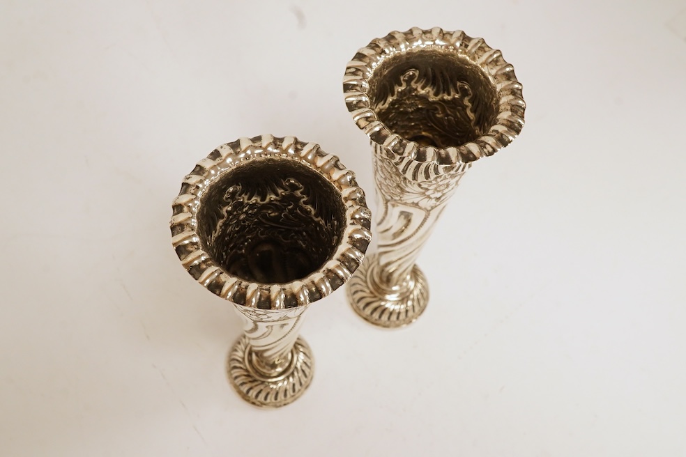 A pair of Edwardian silver spill vases, by S.W. Smith & Co, London, 1905, height 16.1cm, weighted, one split. Condition - poor